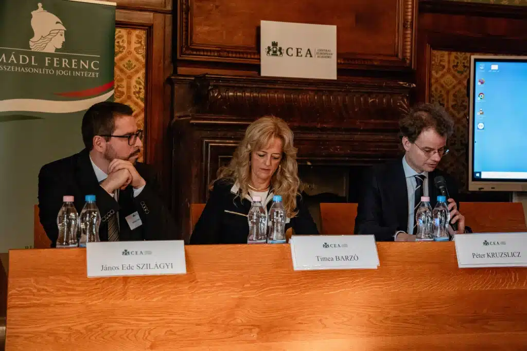 Speakers at a panel discussion in front of the CEA logo