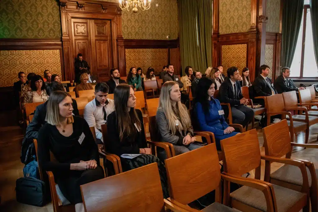 Audience members listening attentively