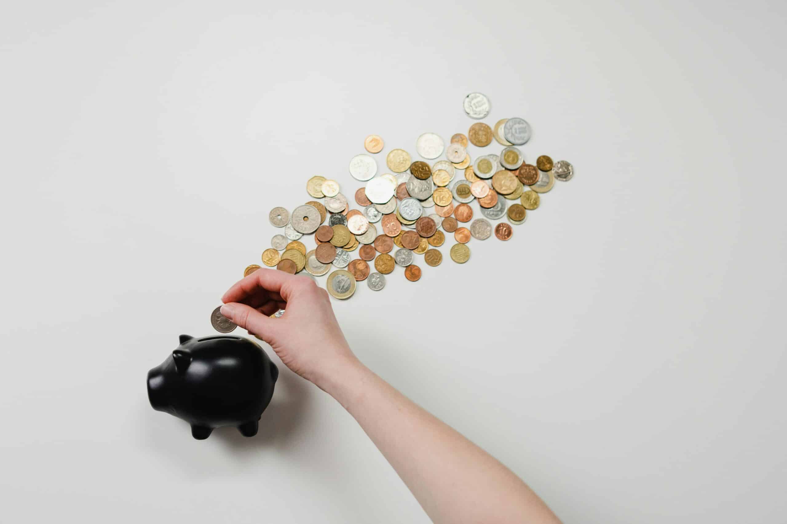 Coins spilling out of a piggy bank