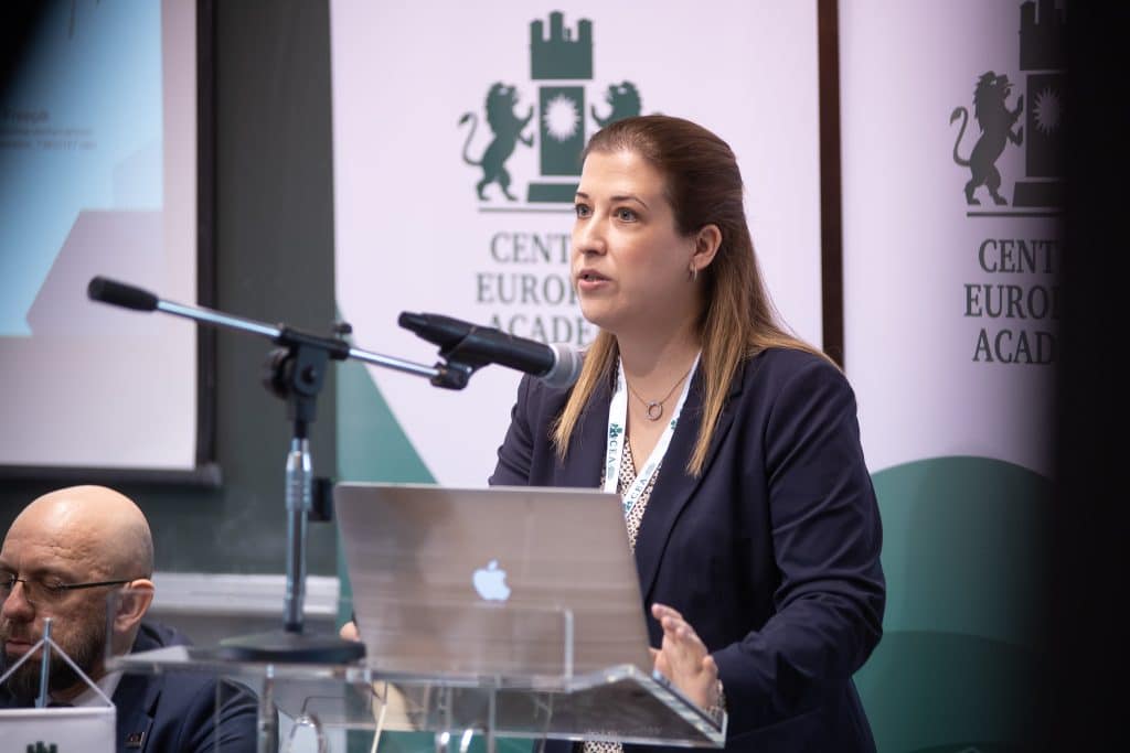 Female speaker at the CEA podium addressing the audience