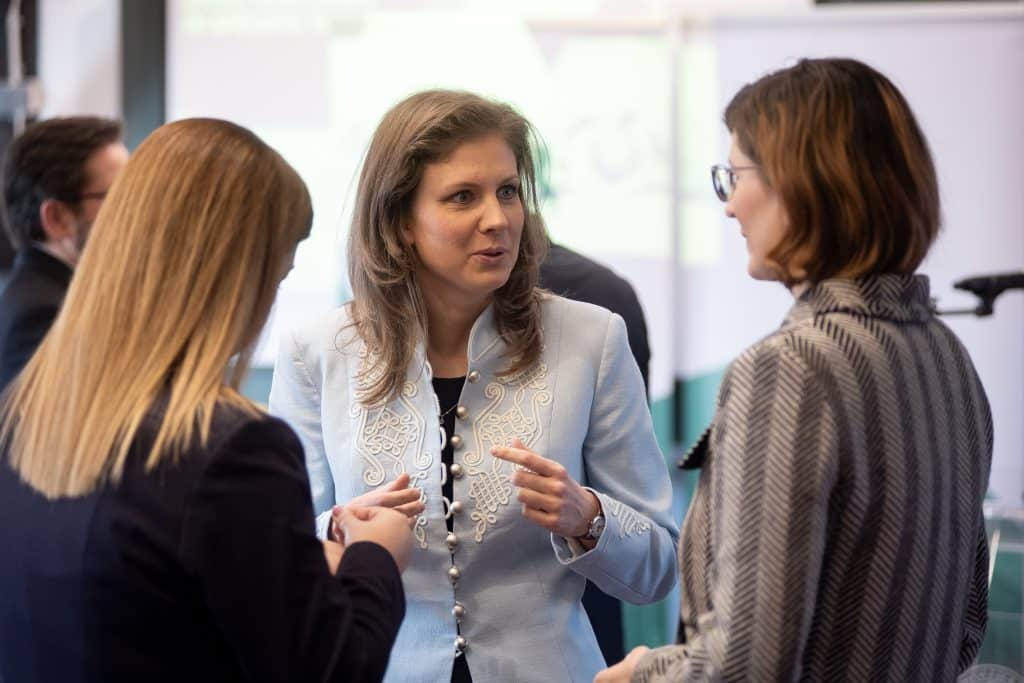 Participants talking during the conference break