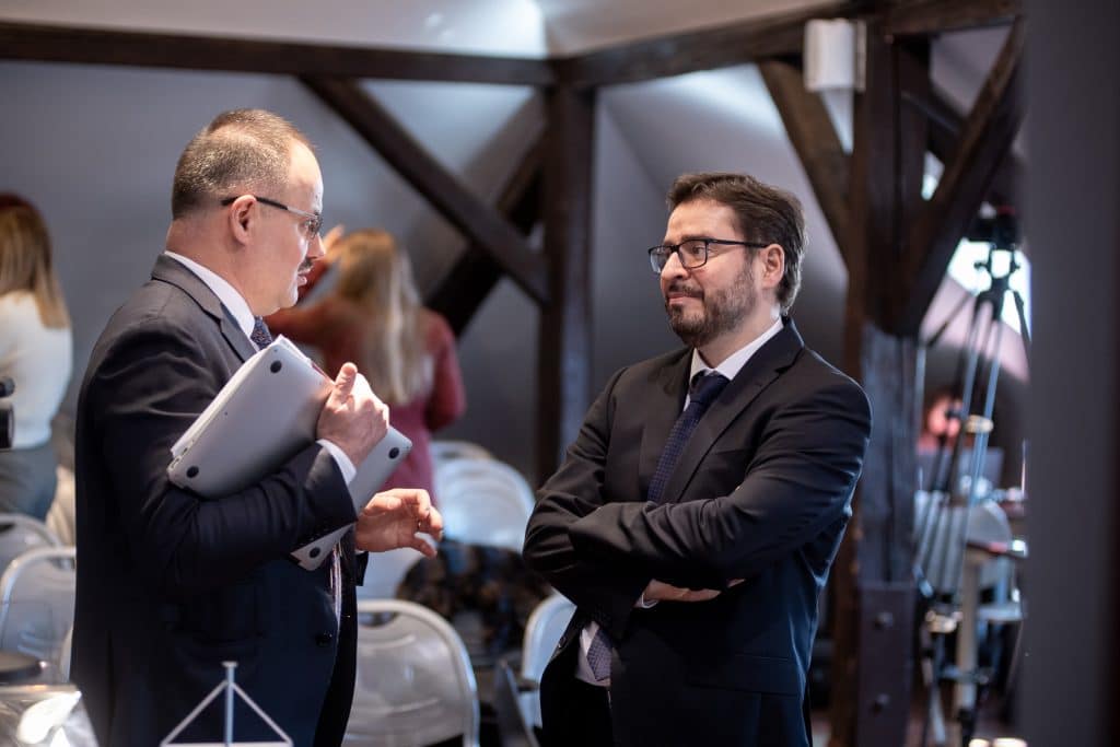 Participants talking during the conference break