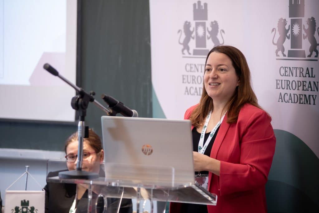 Female speaker at the CEA podium addressing the audience