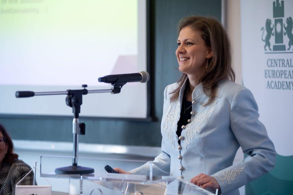 Female speaker at the CEA podium addressing the audience