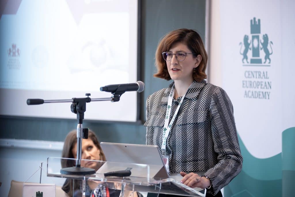 Female speaker at the CEA podium addressing the audience