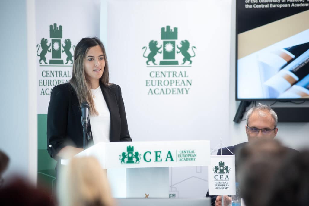 Female speaker at the CEA podium addressing the audience