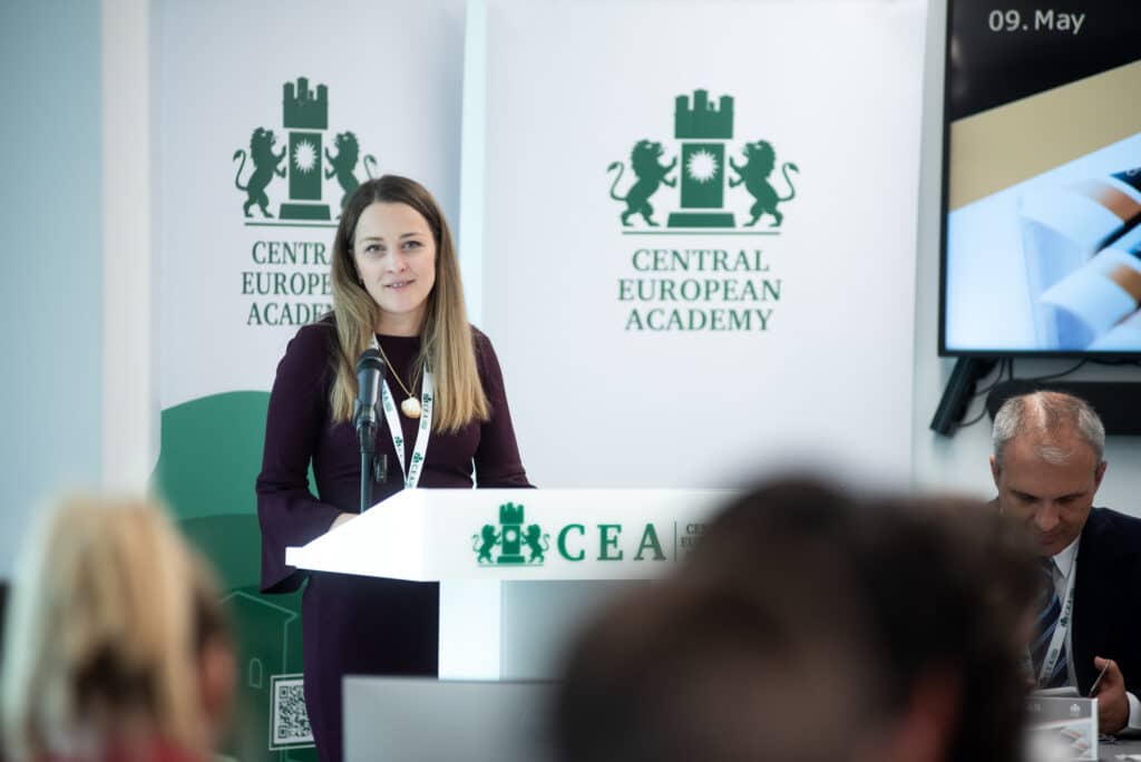 Female speaker at the CEA podium addressing the audience