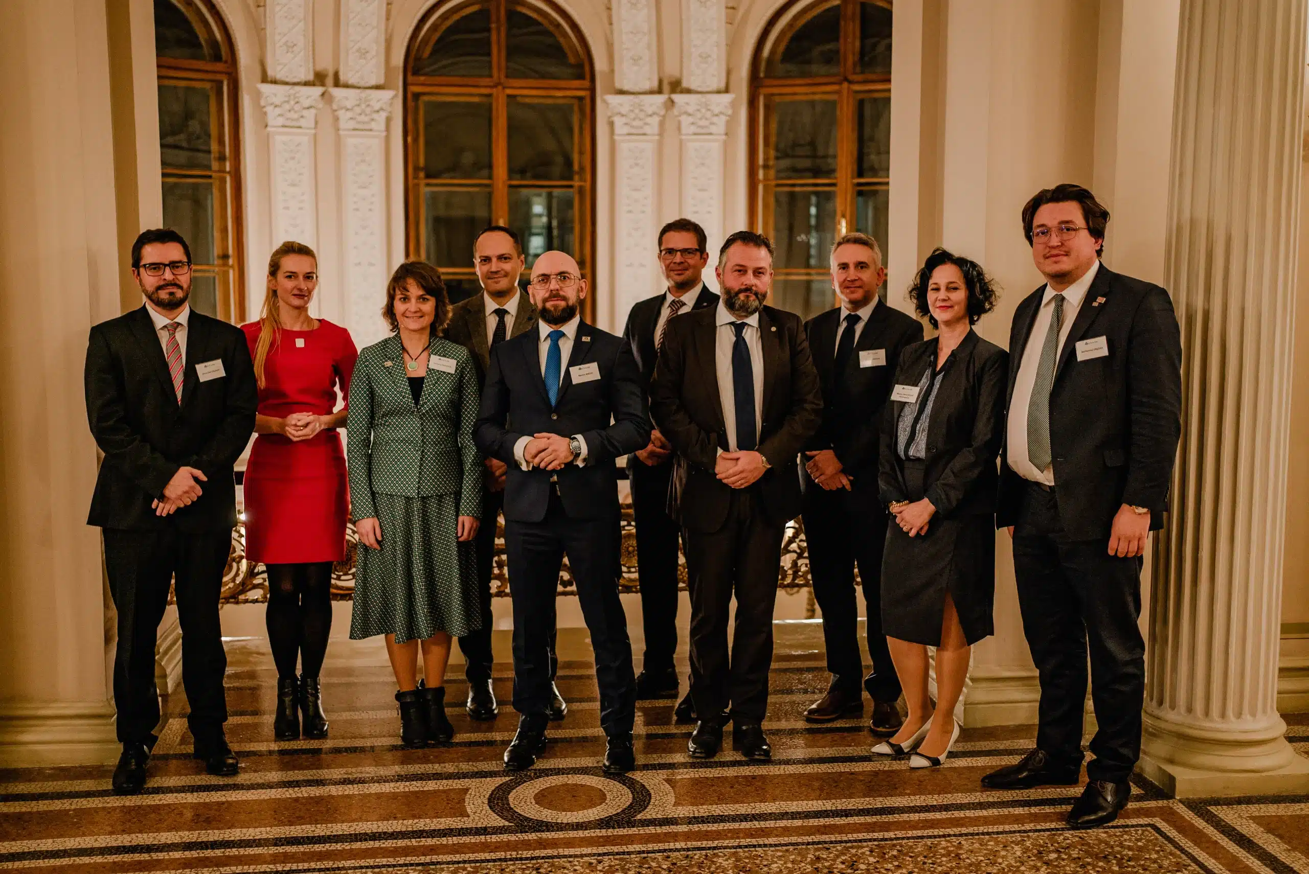 Group photo of elegantly dressed participants at an event