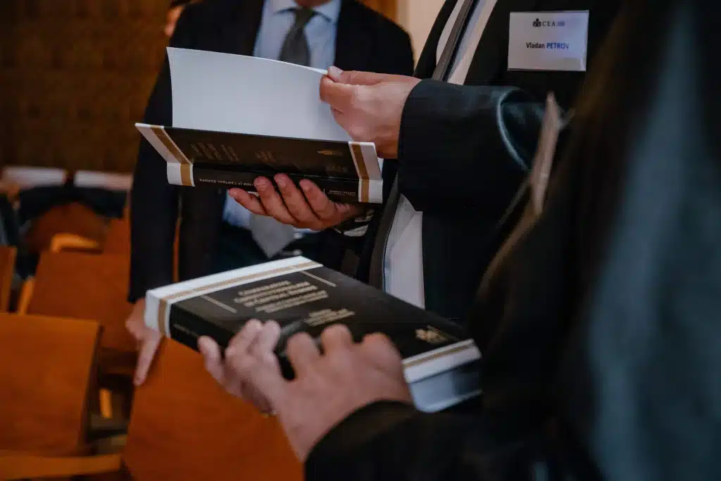 Participant holding a book at the conference