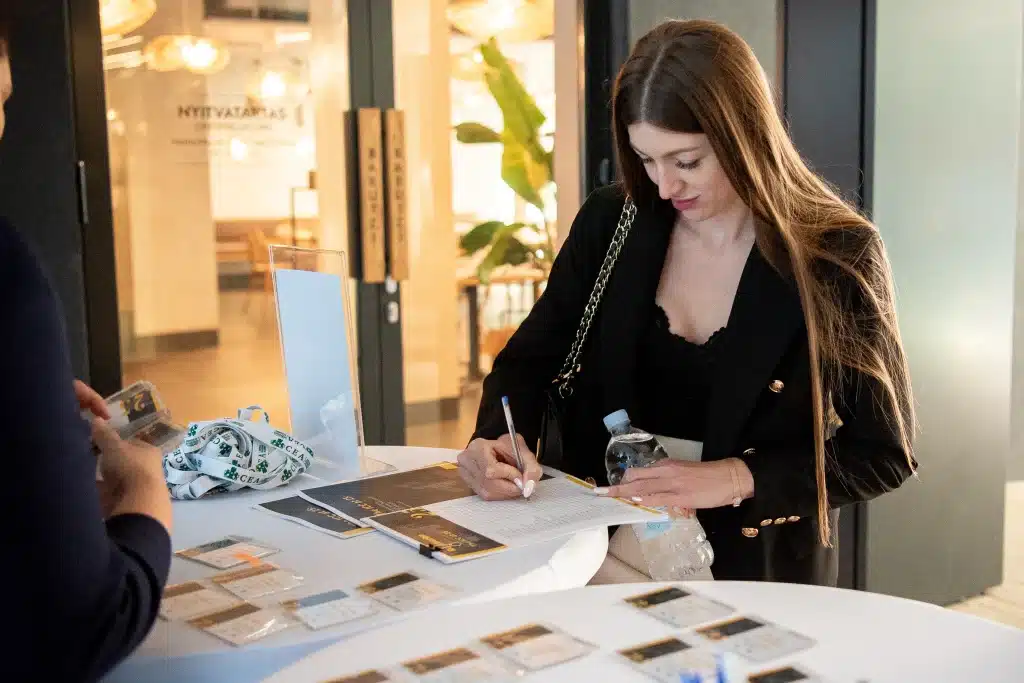 Signing a contract at a desk