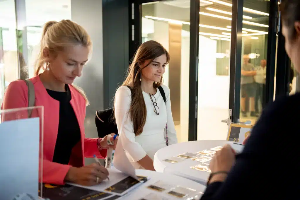 Signing a contract at a desk