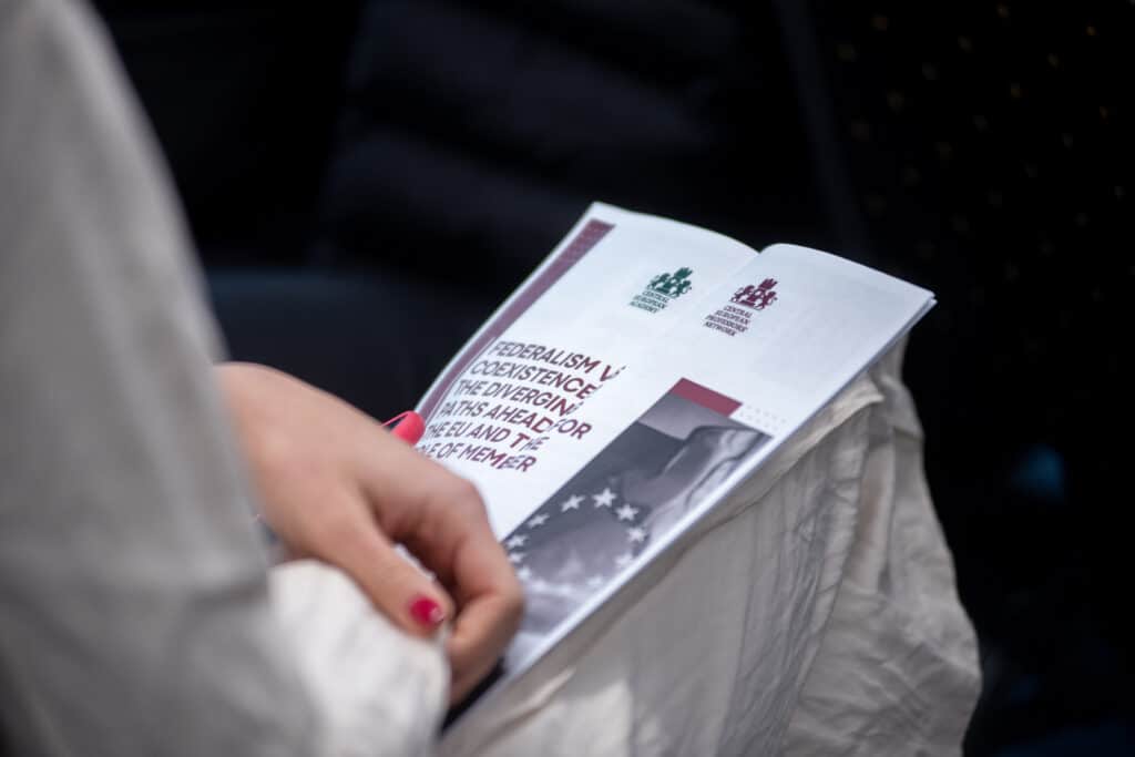Participant browsing the conference program booklet