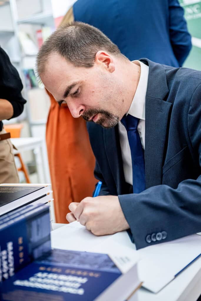 Signing a contract at a desk