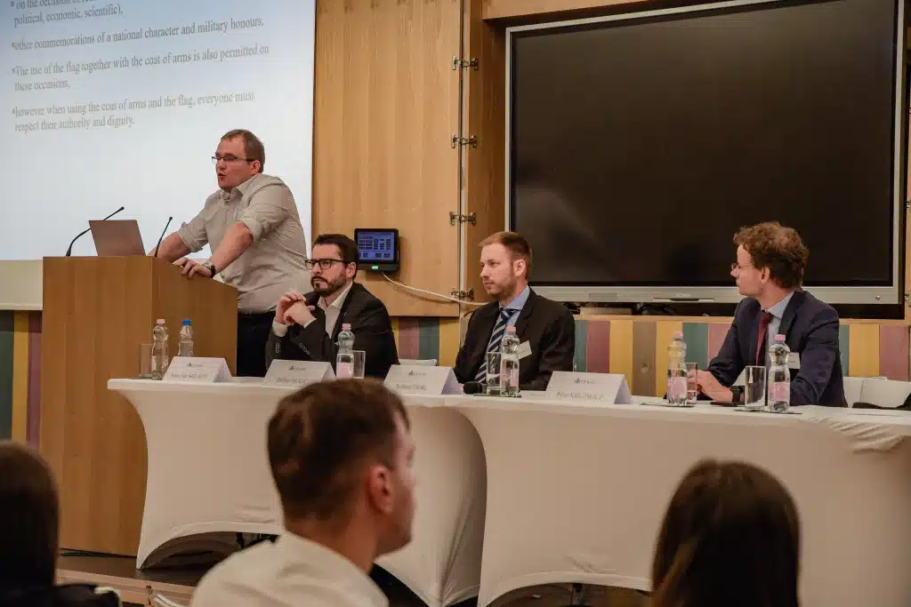 Speakers at a panel discussion in front of the CEA logo