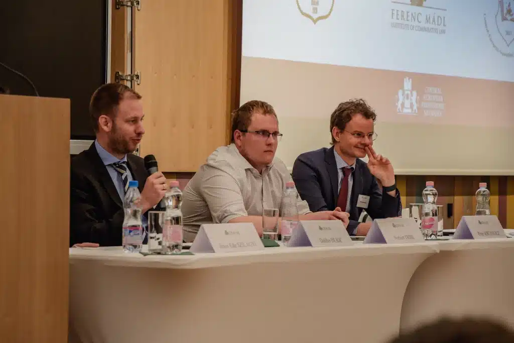 Speakers at a panel discussion in front of the CEA logo