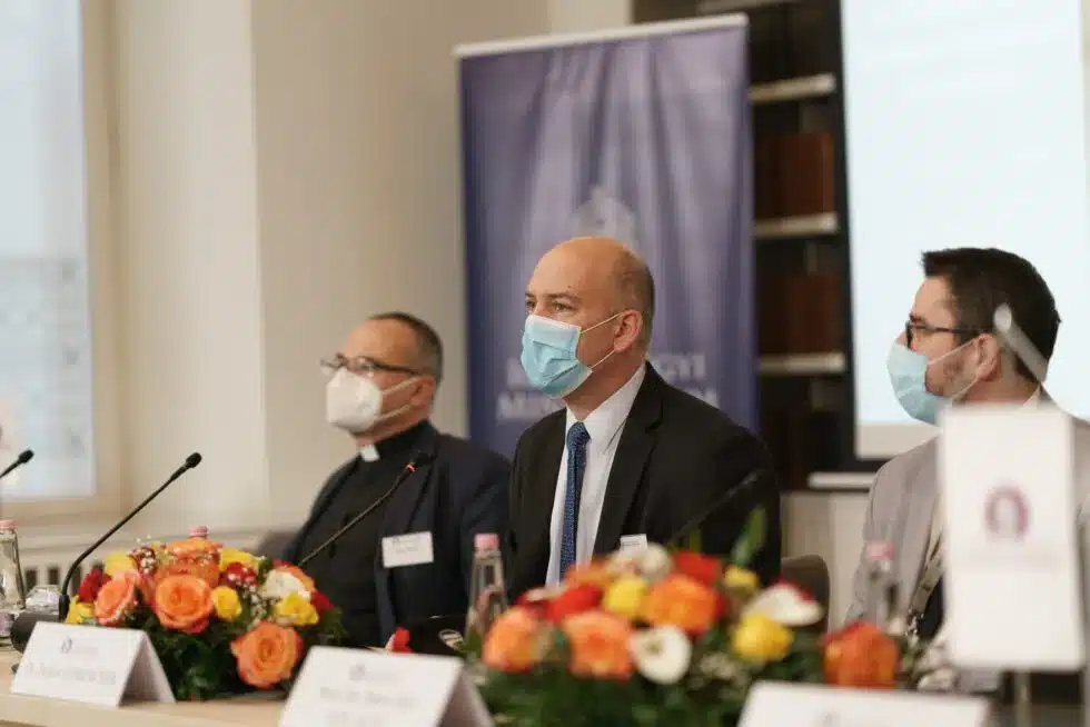 Speakers at a panel discussion in front of the CEA logo