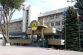 University building with a modern entrance and signage.