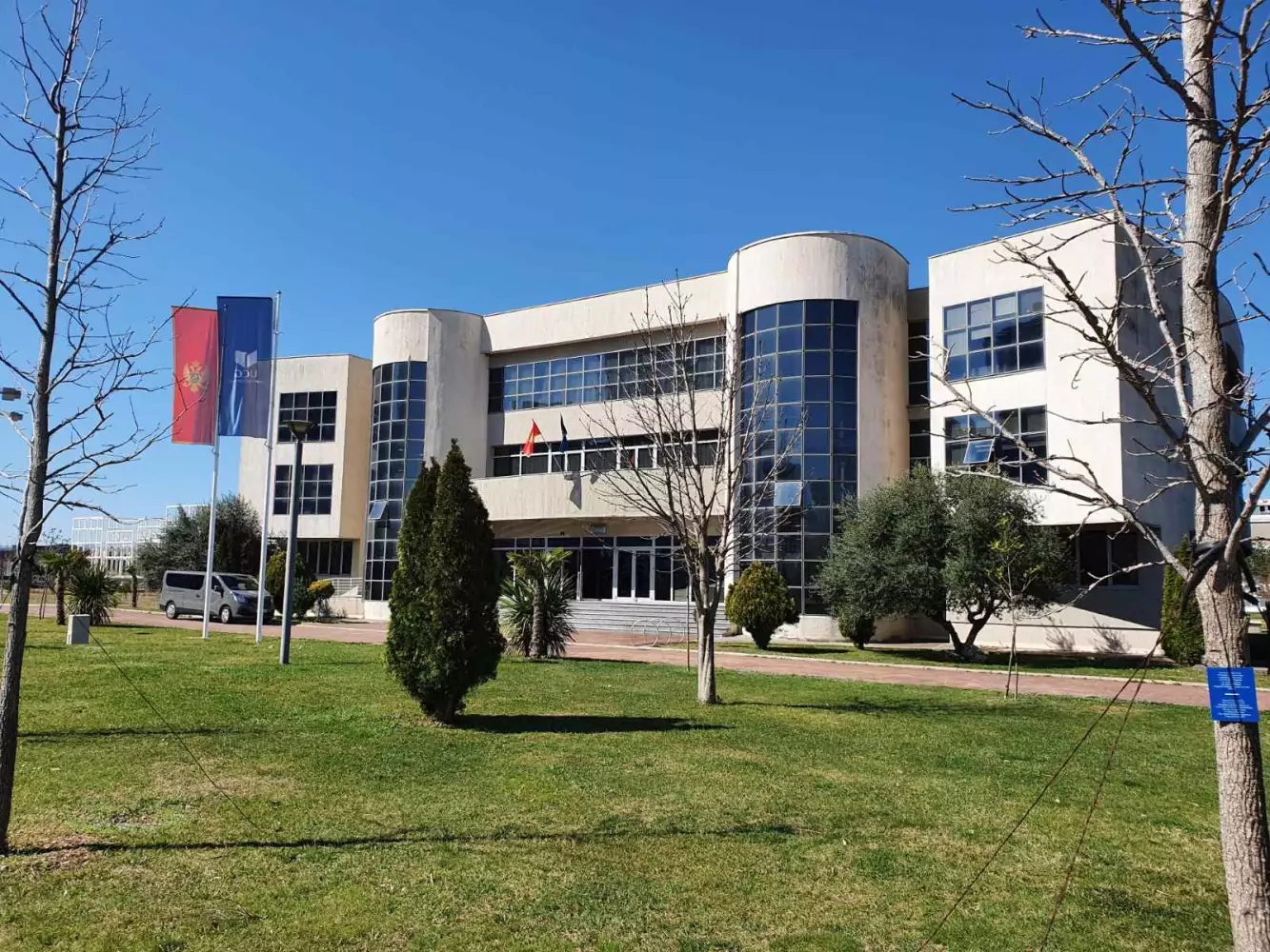 Modern university campus with a rounded façade building.