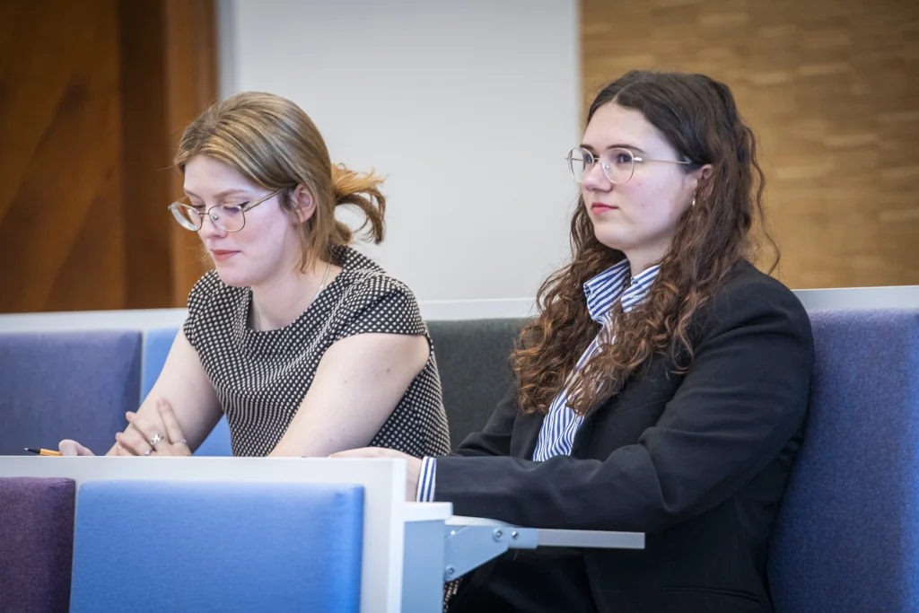 Audience members listening attentively