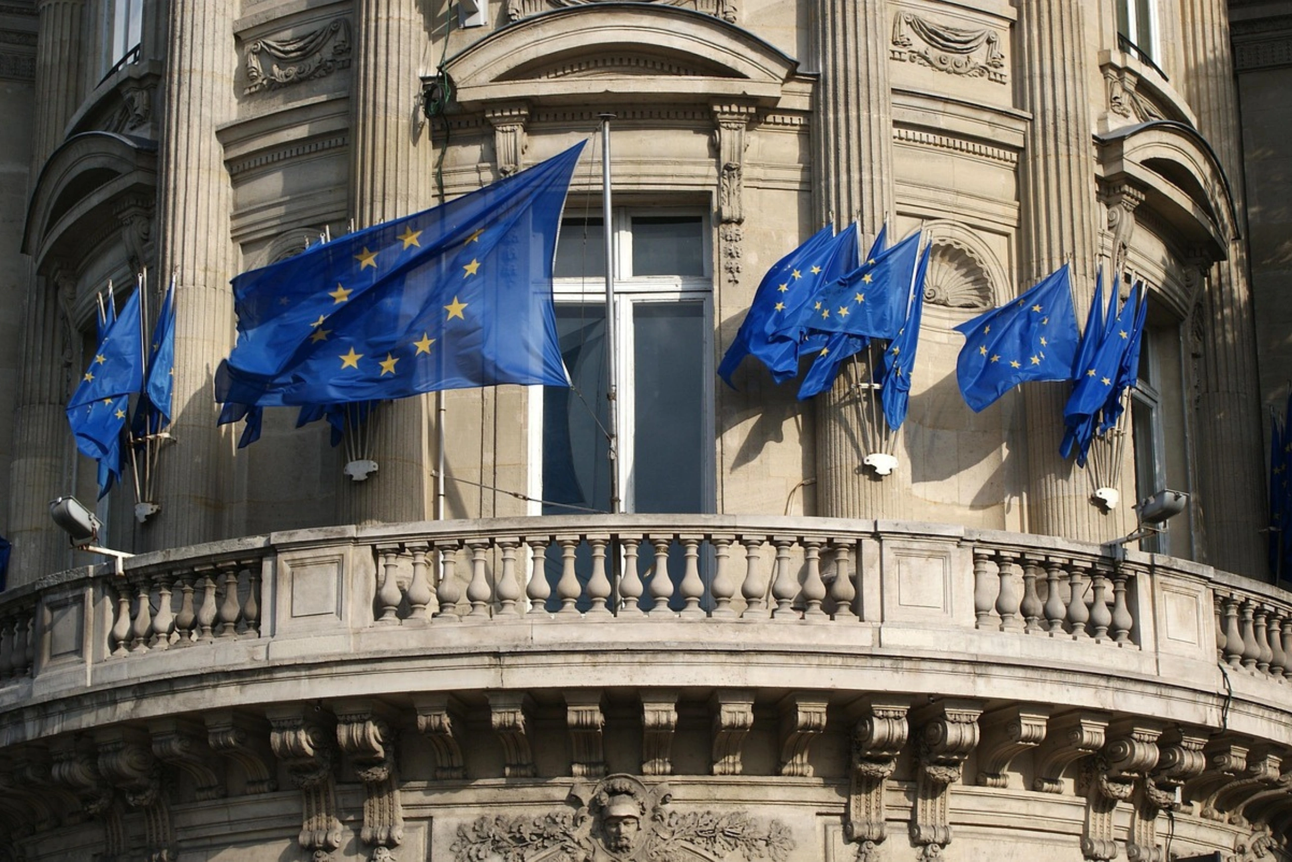 European Union flags on a building facade
