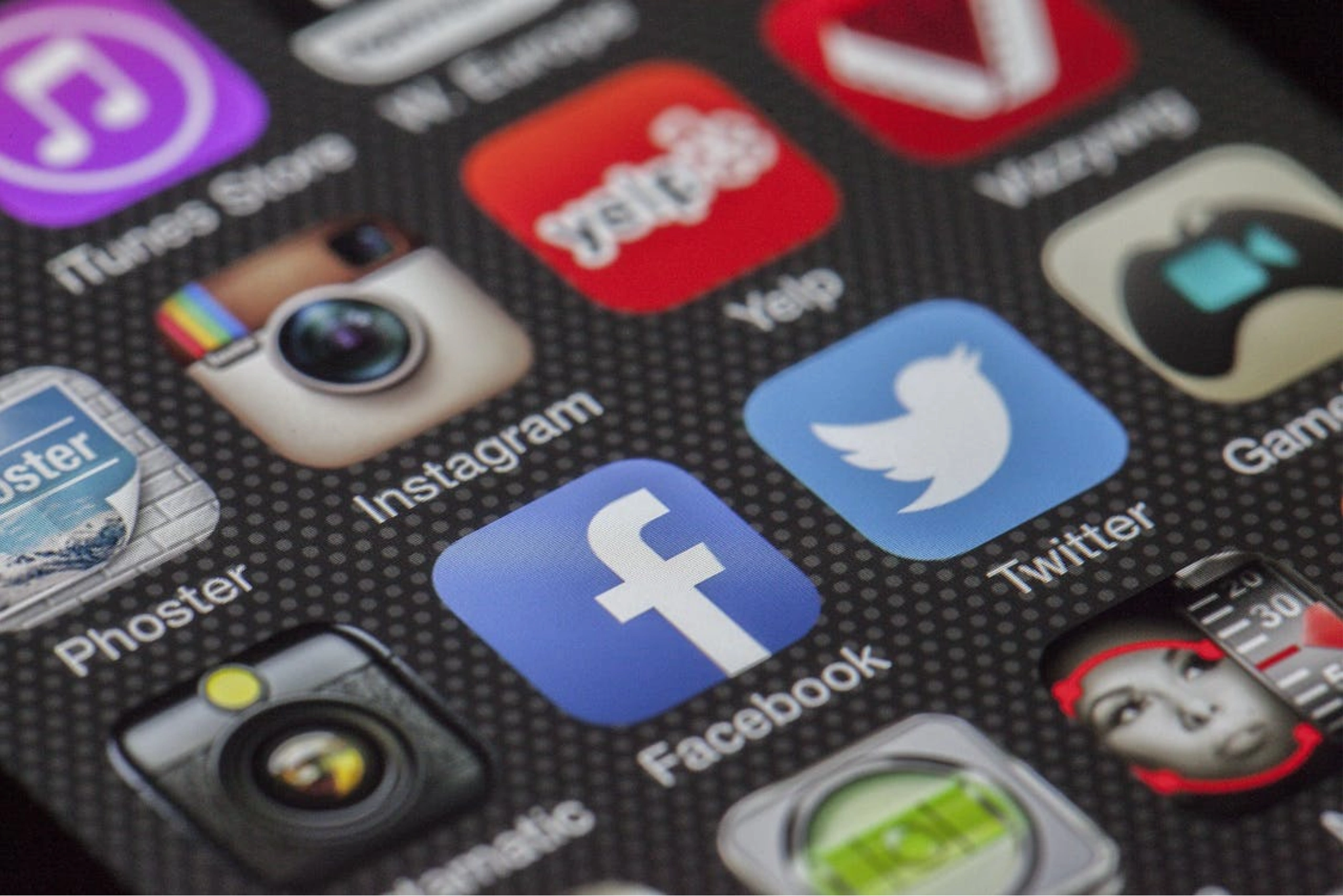 Popular social media icons on a smartphone screen